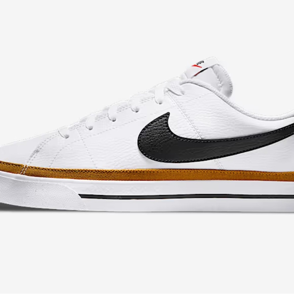 Nike White Sneakers with Black Swoosh and Gold Detail